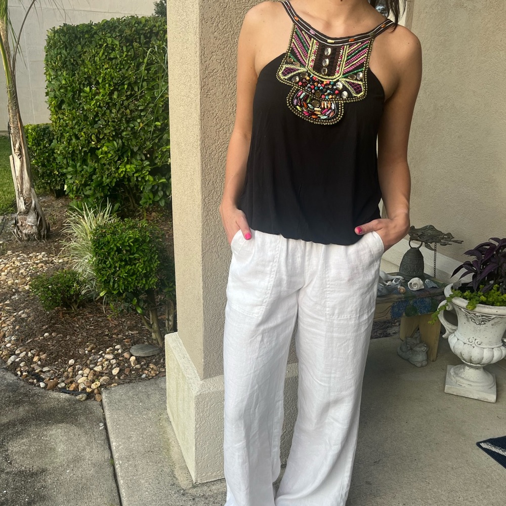 Cute embellished black top. Size S. Elastic at bottom. Flowy